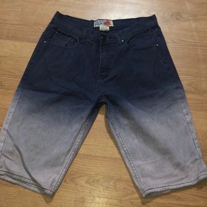 Shorts that are a gradient from a dark purple to a light Purple ish color